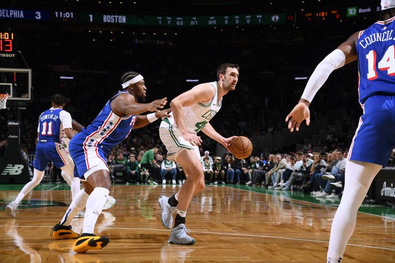 BOSTON, MA - OCTOBER 12: Luke Kornet #40 of the Boston Celtics handles the ball during the game against the Philadelphia 76ers during a NBA Preseason game on October 12, 2024 at TD Garden in Boston, Massachusetts. NOTE TO USER: User expressly acknowledges and agrees that, by downloading and/or using this Photograph, user is consenting to the terms and conditions of the Getty Images License Agreement. Mandatory Copyright Notice: Copyright 2024 NBAE (Photo by Brian Babineau/NBAE via Getty Images)