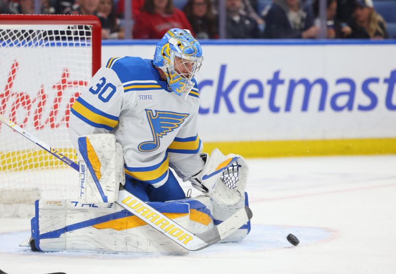 Nov 6, 2025; Buffalo, New York, USA;  St. Louis Blues goaltender Joel Hofer (30) makes a glove save during the second period against the Buffalo Sabres at KeyBank Center. Mandatory Credit: Timothy T. Ludwig-Imagn Images