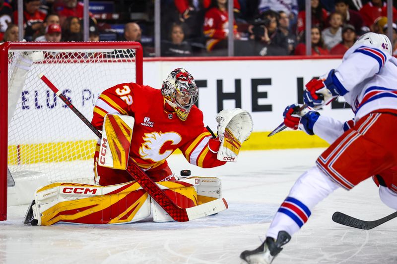 Oct 26, 2025; Calgary, Alberta, CAN; New York Rangers center Noah Laba (42) scores a goal against Calgary Flames goaltender Dustin Wolf (32) during the first period at Scotiabank Saddledome. Mandatory Credit: Sergei Belski-Imagn Images