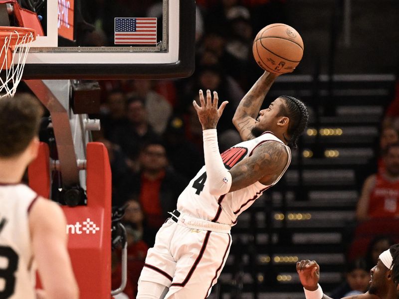 HOUSTON, TEXAS - NOVEMBER 23: Jalen Green #4 of the Houston Rockets scores against the Portland Trail Blazers during the second quarter at Toyota Center on November 23, 2024 in Houston, Texas. NOTE TO USER: User expressly acknowledges and agrees that, by downloading and or using this photograph, User is consenting to the terms and conditions of the Getty Images License Agreement. (Photo by Jack Gorman/Getty Images)