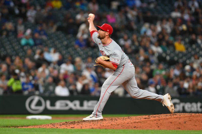 Jul 22, 2024; Seattle, Washington, USA; Los Angeles Angels relief pitcher Hunter Strickland (61) pitches to the Seattle Mariners during the seventh inning at T-Mobile Park. Mandatory Credit: Steven Bisig-USA TODAY Sports