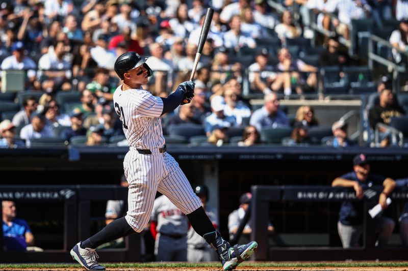 Sep 15, 2024; Bronx, New York, USA;  New York Yankees center fielder Aaron Judge (99) hits a two-run home run in the third inning against the Boston Red Sox at Yankee Stadium. Mandatory Credit: Wendell Cruz-Imagn Images