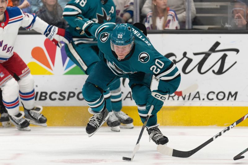 Jan 23, 2024; San Jose, California, USA; San Jose Sharks left wing Fabian Zetterlund (20) chases after the puck during the third period against the New York Rangers at SAP Center at San Jose. Mandatory Credit: Stan Szeto-USA TODAY Sports