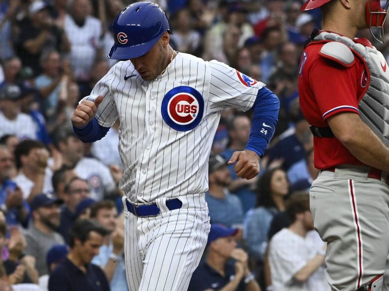 Jun 29, 2023; Chicago, Illinois, USA;   Chicago Cubs center fielder Cody Bellinger (24) scores against the Philadelphia Phillies during the second inning at Wrigley Field. Mandatory Credit: Matt Marton-USA TODAY Sports