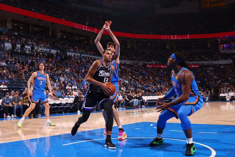 OKLAHOMA CITY, OK - APRIL 9: Keegan Murray #13 of the Sacramento Kings drives to the basket during the game against the Oklahoma City Thunder  on April 9, 2024 at Paycom Arena in Oklahoma City, Oklahoma. NOTE TO USER: User expressly acknowledges and agrees that, by downloading and or using this photograph, User is consenting to the terms and conditions of the Getty Images License Agreement. Mandatory Copyright Notice: Copyright 2024 NBAE (Photo by Zach Beeker/NBAE via Getty Images)