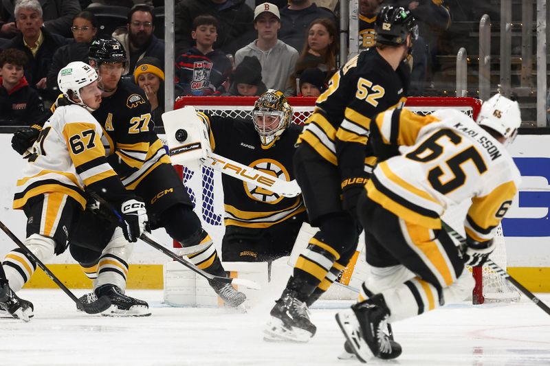 Mar 3, 2026; Boston, Massachusetts, USA; Boston Bruins goaltender Jeremy Swayman (1) makes a blocker save on a shot by Pittsburgh Penguins defenseman Erik Karlsson (65) during the third period at TD Garden. Mandatory Credit: Winslow Townson-Imagn Images