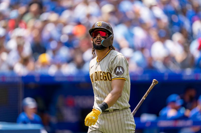 Jul 20, 2023; Toronto, Ontario, CAN; San Diego Padres right fielder Fernando Tatis Jr. (23) reacts after lining out against the Toronto Blue Jays during the first inning out  at Rogers Centre. Mandatory Credit: Kevin Sousa-USA TODAY Sports