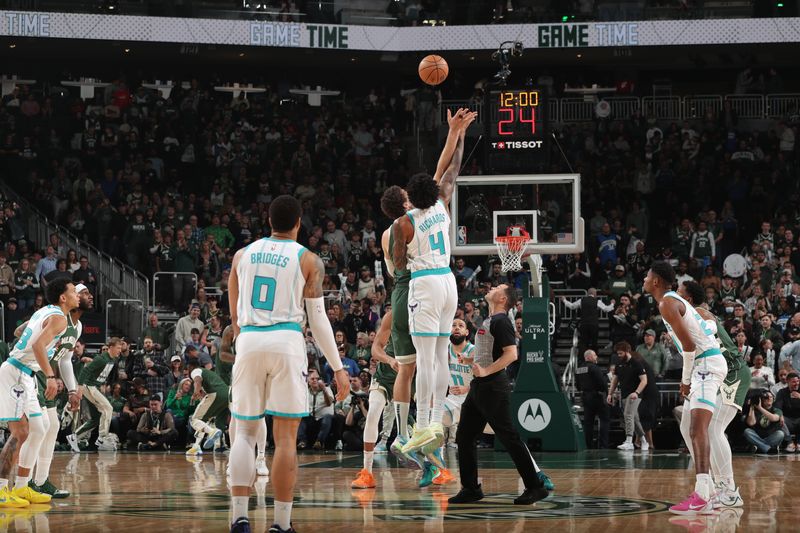 MILWAUKEE, WI - FEBRUARY 27: Brook Lopez #11 of the Milwaukee Bucks goes for the tip-off against Nick Richards #4 of the Charlotte Hornets on February 27, 2024 at the Fiserv Forum Center in Milwaukee, Wisconsin. NOTE TO USER: User expressly acknowledges and agrees that, by downloading and or using this Photograph, user is consenting to the terms and conditions of the Getty Images License Agreement. Mandatory Copyright Notice: Copyright 2024 NBAE (Photo by Gary Dineen/NBAE via Getty Images).