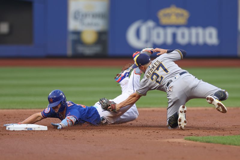 Jun 29, 2023; New York City, New York, USA; New York Mets first baseman Pete Alonso (20) is tagged out by Milwaukee Brewers shortstop Willy Adames (27) attempting to stretch a single during the second inning at Citi Field. Mandatory Credit: Vincent Carchietta-USA TODAY Sports