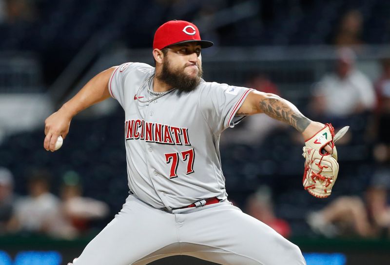 Aug 13, 2023; Pittsburgh, PA, USA; Cincinnati Reds relief pitcher Daniel Duarte (77) pitches the tenth inning against the Pittsburgh Pirates at PNC Park. The Reds won 6-5 in ten innings. Mandatory Credit: Charles LeClaire-USA TODAY Sports