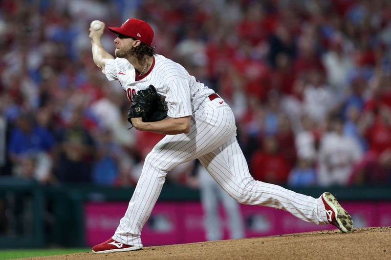 Oct 4, 2023; Philadelphia, Pennsylvania, USA; Philadelphia Phillies starting pitcher Aaron Nola (27) throws a pitch against the Miami Marlins during the first inning for game two of the Wildcard series for the 2023 MLB playoffs at Citizens Bank Park. Mandatory Credit: Bill Streicher-USA TODAY Sports