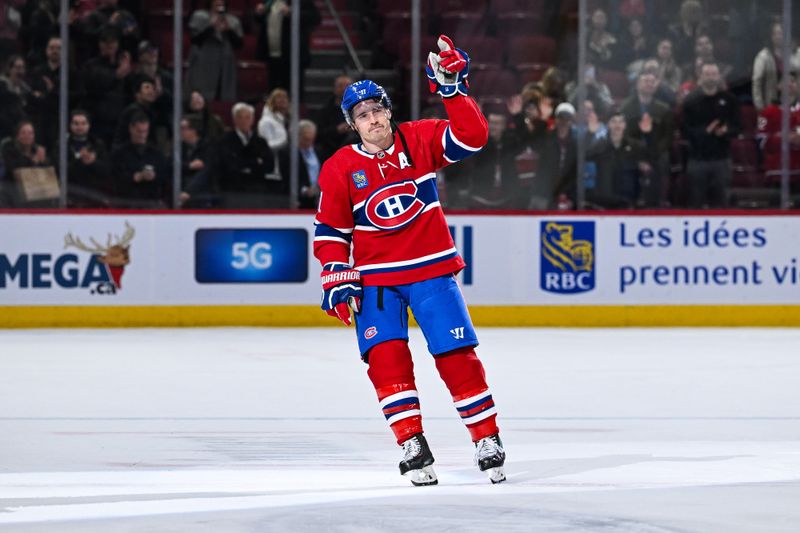 Mar 12, 2024; Montreal, Quebec, CAN; Montreal Canadiens right wing Brendan Gallagher (11) third star of the game salutes the crowd after the end of the game against the Columbus Blue Jackets at Bell Centre. Mandatory Credit: David Kirouac-USA TODAY Sports