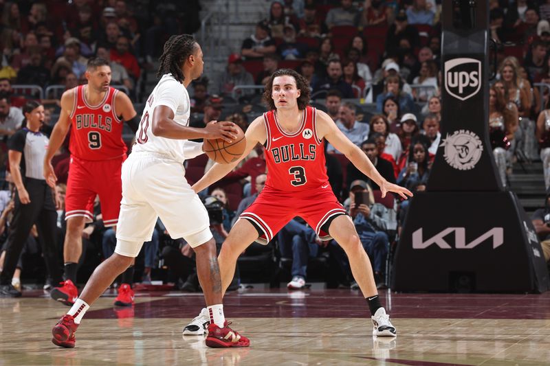 CLEVELAND, OH - OCTOBER 8:  Josh Giddey #3 of the Chicago Bulls plays defense against the Cleveland Cavaliers on October 8, 2024 at Rocket Mortgage FieldHouse in Cleveland, Ohio. NOTE TO USER: User expressly acknowledges and agrees that, by downloading and/or using this Photograph, user is consenting to the terms and conditions of the Getty Images License Agreement. Mandatory Copyright Notice: Copyright 2024 NBAE (Photo by Jeff Haynes/NBAE via Getty Images)