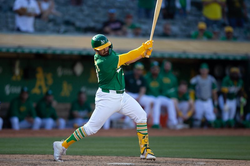 May 8, 2024; Oakland, California, USA; Oakland Athletics designated hitter Shea Langeliers (23) swings and misses at strike three against the Texas Rangers during the sixth inning at Oakland-Alameda County Coliseum. Mandatory Credit: D. Ross Cameron-USA TODAY Sports