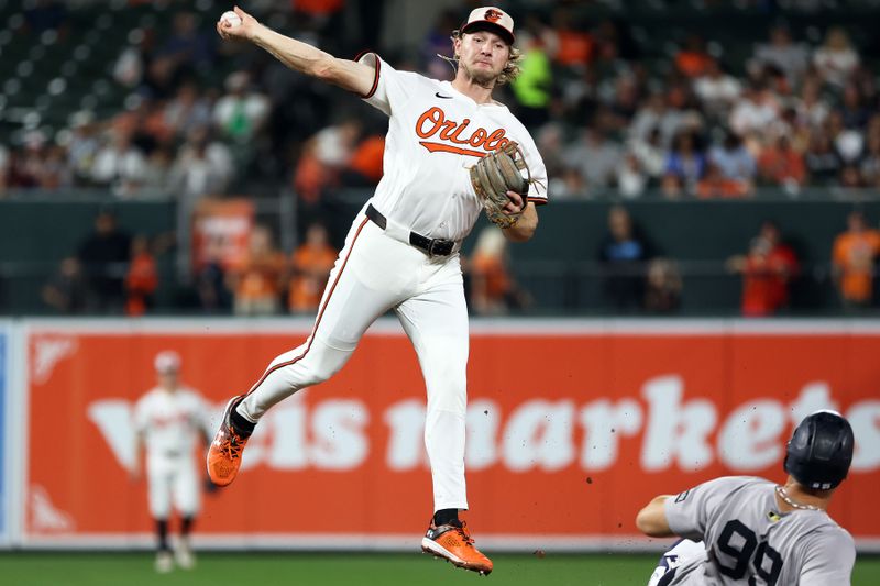 Sep 18, 2025; Baltimore, Maryland, USA; Baltimore Orioles shortstop Gunnar Henderson (2) turns a double play past New York Yankees outfielder Aaron Judge (99) during the third inning at Oriole Park at Camden Yards. Mandatory Credit: Daniel Kucin Jr.-Imagn Images