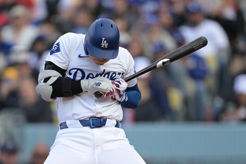 Apr 14, 2024; Los Angeles, California, USA; Los Angeles Dodgers designated hitter Shohei Ohtani (17) backs off an inside pitch in the third inning against the San Diego Padres at Dodger Stadium. Mandatory Credit: Jayne Kamin-Oncea-USA TODAY Sports