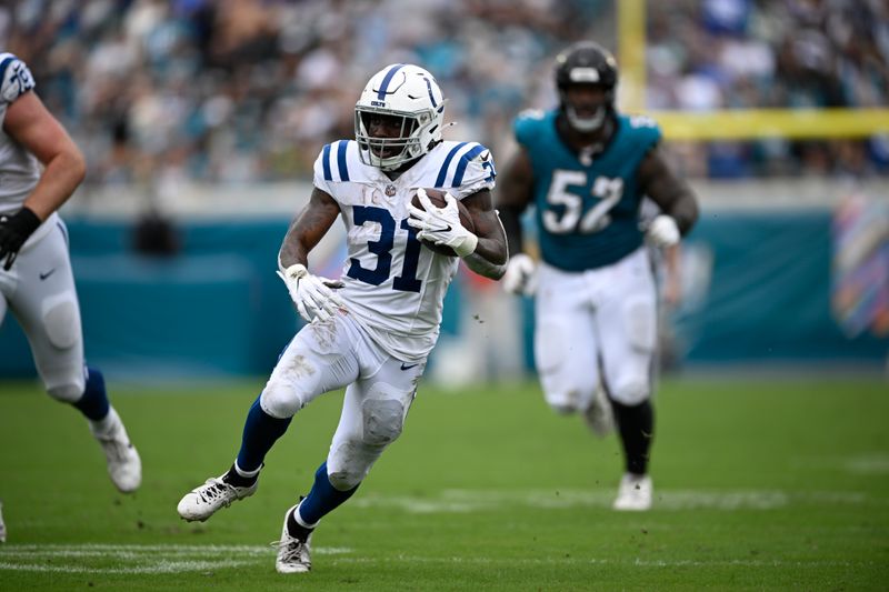 Indianapolis Colts' Tyler Goodson (31) runs during the second half of an NFL football game against the Jacksonville Jaguars, Sunday, Oct. 6, 2024, in Jacksonville, Fla. (AP Photo/Phelan M. Ebenhack)