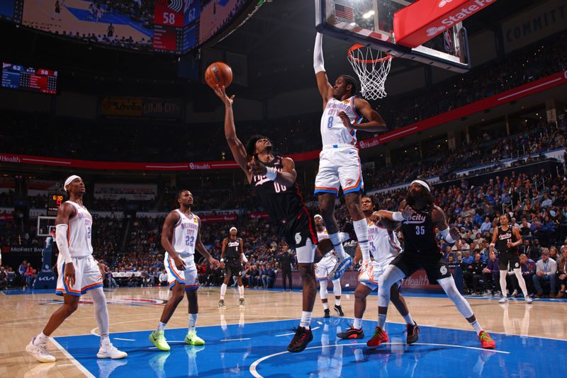 OKLAHOMA CITY, OK - NOVEMBER 20: Scoot Henderson #00 of the Portland Trail Blazers drives to the basket during the game against the Oklahoma City Thunder on November 20, 2024 at Paycom Center in Oklahoma City, Oklahoma. NOTE TO USER: User expressly acknowledges and agrees that, by downloading and or using this photograph, User is consenting to the terms and conditions of the Getty Images License Agreement. Mandatory Copyright Notice: Copyright 2024 NBAE (Photo by Zach Beeker/NBAE via Getty Images)