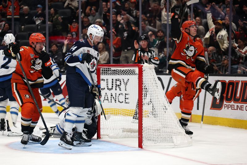 Nov 9, 2025; Anaheim, California, USA;  Anaheim Ducks right wing Beckett Sennecke (45, right) celebrates after scoring a goal during the second period against the Winnipeg Jets at Honda Center. Mandatory Credit: Kiyoshi Mio-Imagn Images