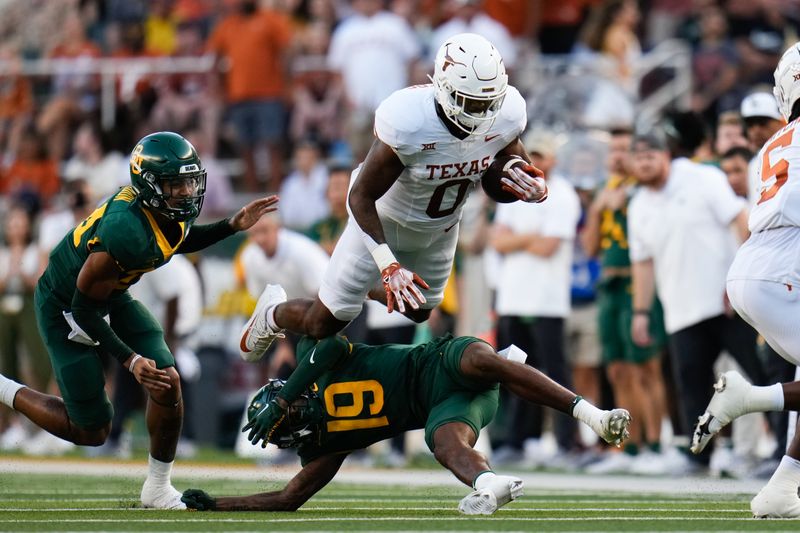 Sep 23, 2023; Waco, Texas, USA;  Texas Longhorns tight end Ja'Tavion Sanders (0) makes a catch and is tackled by Baylor Bears cornerback Caden Jenkins (19) during the first half at McLane Stadium. Mandatory Credit: Chris Jones-USA TODAY Sports