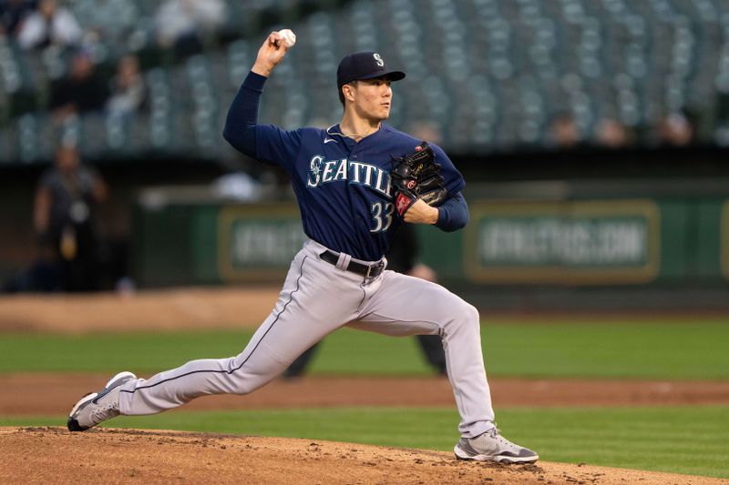 Sep 18, 2023; Oakland, California, USA;  Seattle Mariners starting pitcher Bryan Woo (33) pitches during the first inning against the Oakland Athletics at Oakland-Alameda County Coliseum. Mandatory Credit: Stan Szeto-USA TODAY Sports