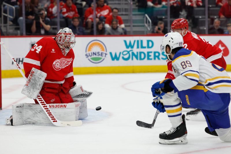 Apr 7, 2024; Detroit, Michigan, USA; Detroit Red Wings goaltender Alex Lyon (34) makes a save in the first period at Little Caesars Arena. Mandatory Credit: Rick Osentoski-USA TODAY Sports