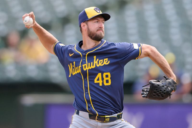 Aug 24, 2024; Oakland, California, USA; Milwaukee Brewers starting pitcher Colin Rea (48) throws a pitch against the Oakland Athletics during the first inning at Oakland-Alameda County Coliseum. Mandatory Credit: Robert Edwards-USA TODAY Sports