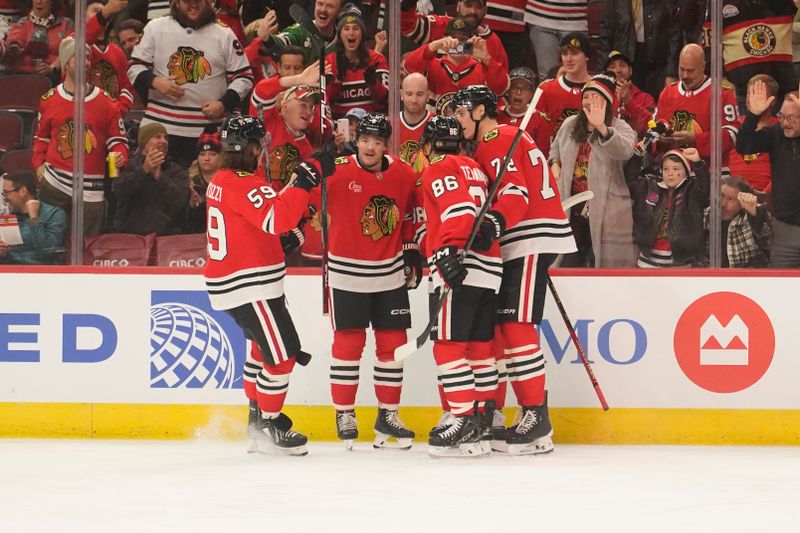 Dec 1, 2024; Chicago, Illinois, USA; Chicago Blackhawks center Connor Bedard (98) celebrates his goal against the Columbus Blue Jackets during the first period at United Center. Mandatory Credit: David Banks-Imagn Images
