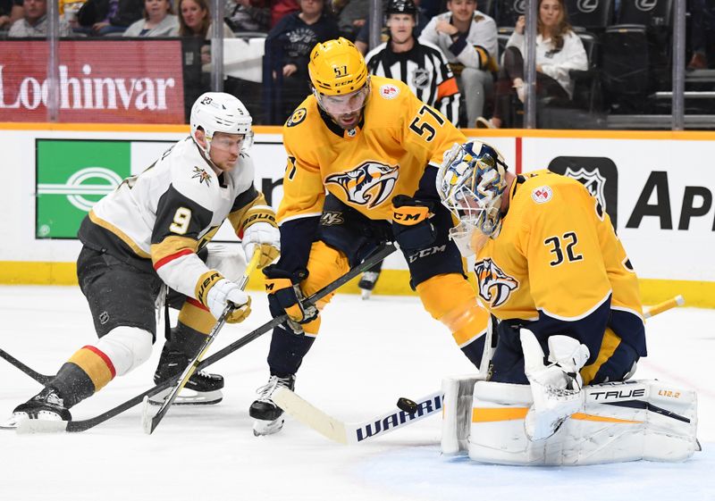 Apr 4, 2023; Nashville, Tennessee, USA; Nashville Predators goaltender Kevin Lankinen (32) makes a save on a shot by Vegas Golden Knights center Jack Eichel (9) during the second period at Bridgestone Arena. Mandatory Credit: Christopher Hanewinckel-USA TODAY Sports