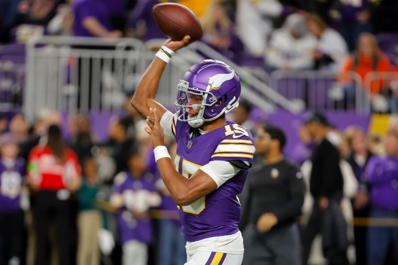 Minnesota Vikings quarterback Joshua Dobbs (15) warms up before an NFL football game against the Chicago Bears, Monday, Nov. 27, 2023, in Minneapolis. (AP Photo/Bruce Kluckhohn)