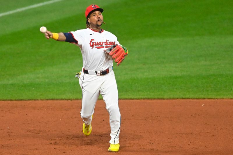 Sep 10, 2025; Cleveland, Ohio, USA; Cleveland Guardians third baseman Jose Ramirez (11) throws to first base in the eighth inning against the Kansas City Royals at Progressive Field. Mandatory Credit: David Richard-Imagn Images