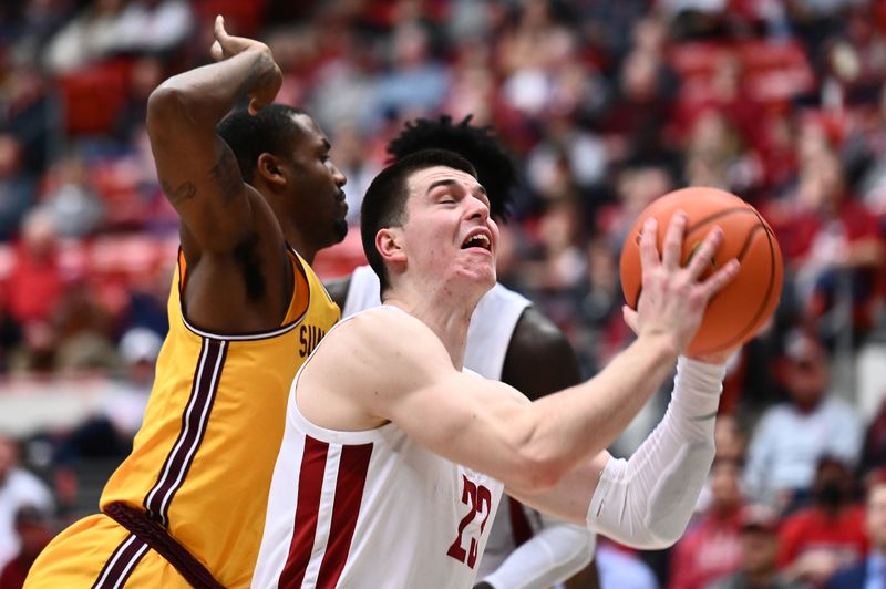 Jan 28, 2023; Pullman, Washington, USA; Washington State Cougars forward Andrej Jakimovski (23) shoots the ball against Arizona State Sun Devils guard Luther Muhammad (1) in the second half at Friel Court at Beasley Coliseum. Washington State won 75-58. Mandatory Credit: James Snook-USA TODAY Sports