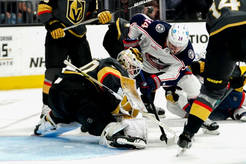 Mar 19, 2023; Las Vegas, Nevada, USA; Columbus Blue Jackets center Cole Sillinger (34) attempts to score against Vegas Golden Knights goaltender Jiri Patera (30) during the third period at T-Mobile Arena. Mandatory Credit: Lucas Peltier-USA TODAY Sports