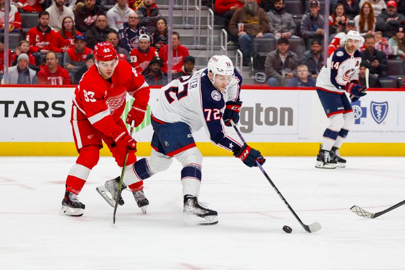 Mar 19, 2024; Detroit, Michigan, USA; Columbus Blue Jackets right wing Carson Meyer (72) handles the puck during the first period of the game against the Detroit Red Wings at Little Caesars Arena. Mandatory Credit: Brian Bradshaw Sevald-USA TODAY Sports