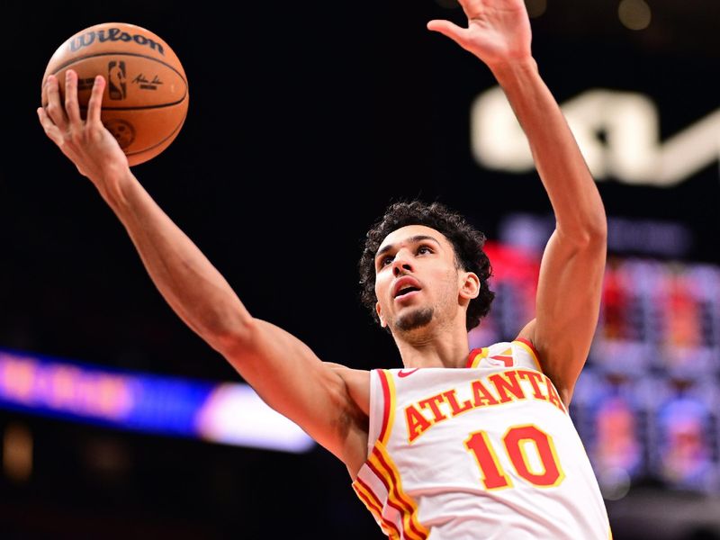 ATLANTA, GA - MARCH 10: Zaccharie Risacher #10 of the Atlanta Hawks drives to the basket during the game against the Philadelphia 76ers on March 10, 2025 at State Farm Arena in Atlanta, Georgia.  NOTE TO USER: User expressly acknowledges and agrees that, by downloading and/or using this Photograph, user is consenting to the terms and conditions of the Getty Images License Agreement. Mandatory Copyright Notice: Copyright 2025 NBAE(Photo by Adam Hagy/NBAE via Getty Images)