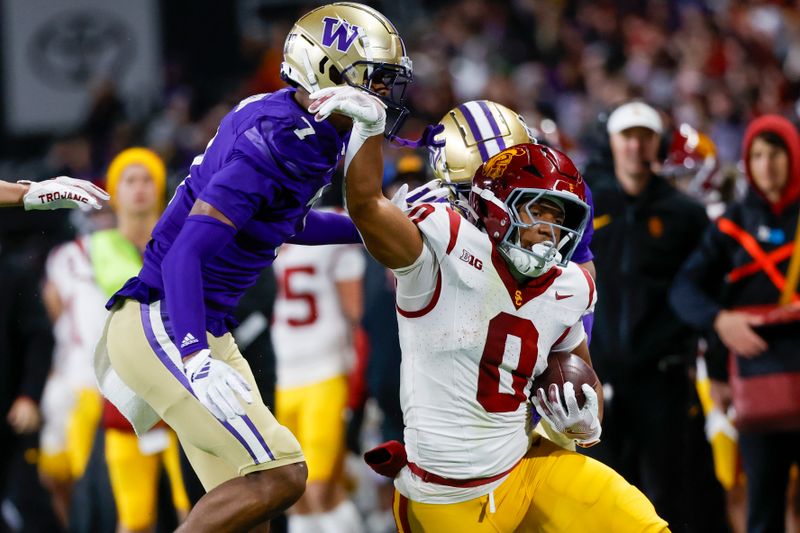 Nov 2, 2024; Seattle, Washington, USA; USC Trojans running back Quinten Joyner (0) rushes against Washington Huskies cornerback Ephesians Prysock (7) during the fourth quarter at Alaska Airlines Field at Husky Stadium. Mandatory Credit: Joe Nicholson-Imagn Images