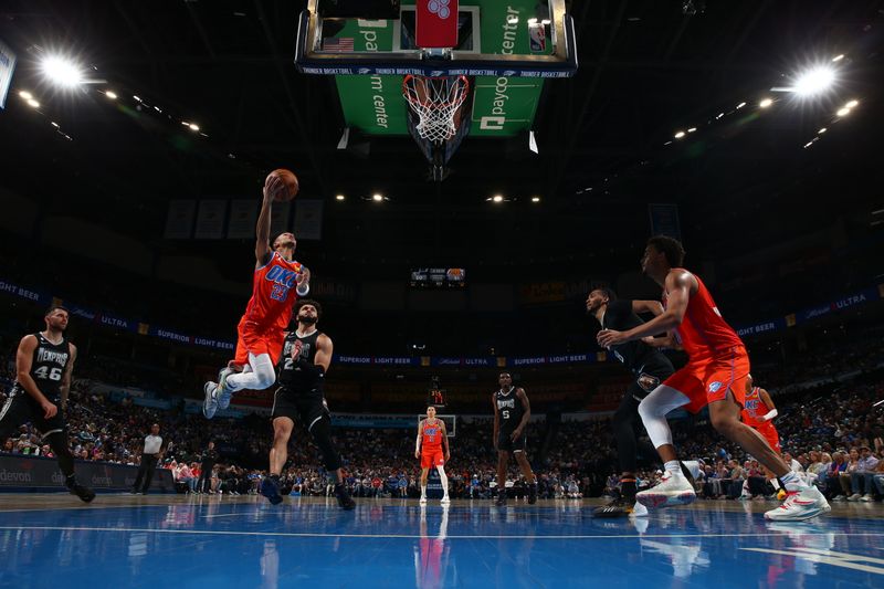 OKLAHOMA CITY, OK - APRIL 9: Tre Mann #23 of the Oklahoma City Thunder drives to the basket during the game against the Memphis Grizzlies on April 9, 2023 at Paycom Arena in Oklahoma City, Oklahoma. NOTE TO USER: User expressly acknowledges and agrees that, by downloading and or using this photograph, User is consenting to the terms and conditions of the Getty Images License Agreement. Mandatory Copyright Notice: Copyright 2023 NBAE (Photo by Zach Beeker/NBAE via Getty Images)