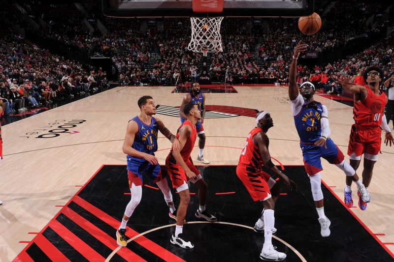 PORTLAND, OR - MARCH 23: Reggie Jackson #7 of the Denver Nuggets drives to the basket during the game against the Portland Trail Blazers on March 23, 2024 at the Moda Center Arena in Portland, Oregon. NOTE TO USER: User expressly acknowledges and agrees that, by downloading and or using this photograph, user is consenting to the terms and conditions of the Getty Images License Agreement. Mandatory Copyright Notice: Copyright 2024 NBAE (Photo by Cameron Browne/NBAE via Getty Images)