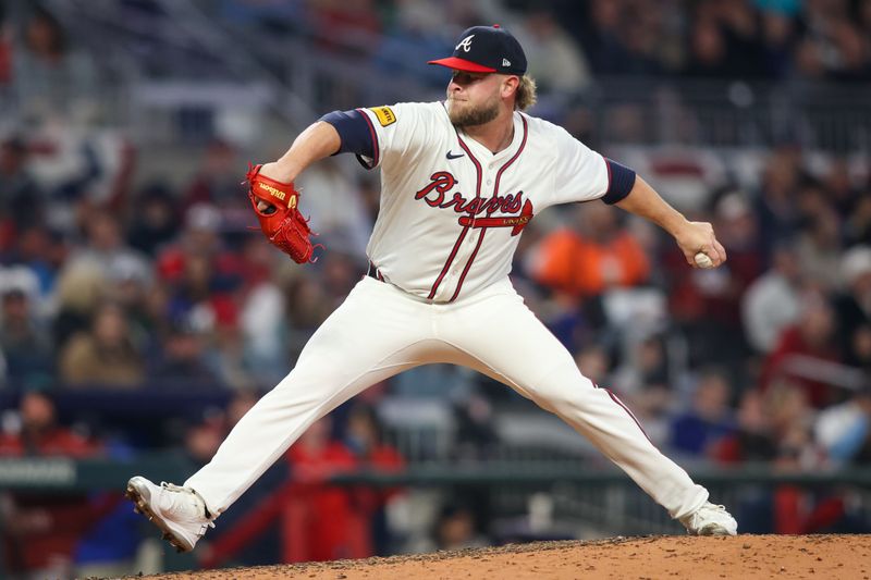 Apr 6, 2024; Atlanta, Georgia, USA; Atlanta Braves relief pitcher A.J. Minter (33) throws against the Arizona Diamondbacks in the eighth inning at Truist Park. Mandatory Credit: Brett Davis-USA TODAY Sports
