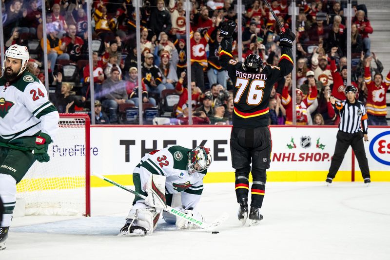 Nov 23, 2024; Calgary, Alberta, CAN; Calgary Flames center Martin Pospisil (76) celebrates after scoring a goal against  Minnesota Wild goaltender Filip Gustavsson (32) during the second period at Scotiabank Saddledome. Mandatory Credit: Brett Holmes-Imagn Images