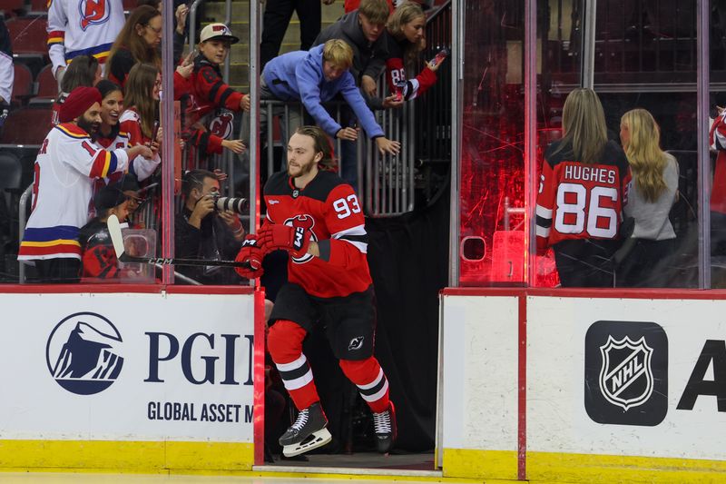 Oct 22, 2024; Newark, New Jersey, USA; New Jersey Devils defenseman Daniil Misyul (93) skates his rookie lap before making his NHL debut against the Tampa Bay Lightning at Prudential Center. Mandatory Credit: Ed Mulholland-Imagn Images