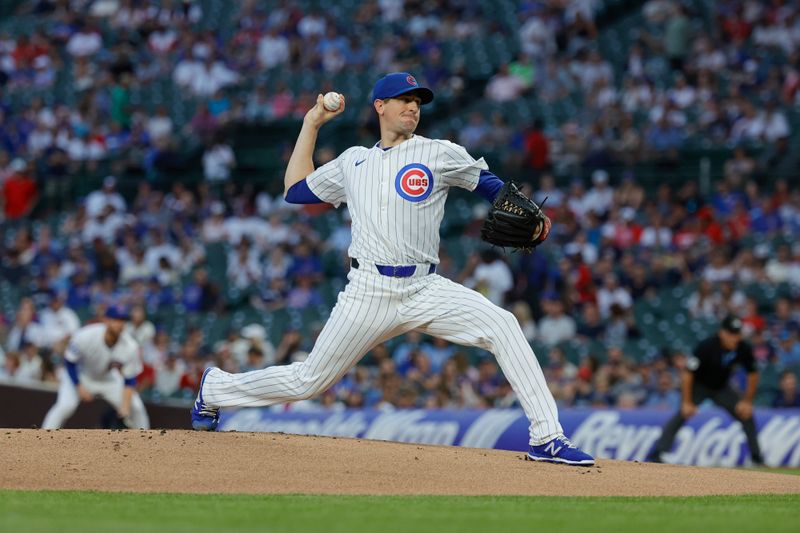 Aug 5, 2024; Chicago, Illinois, USA; Chicago Cubs starting pitcher Kyle Hendricks (28) delivers a pitch against the Minnesota Twins during the first inning at Wrigley Field. Mandatory Credit: Kamil Krzaczynski-USA TODAY Sports