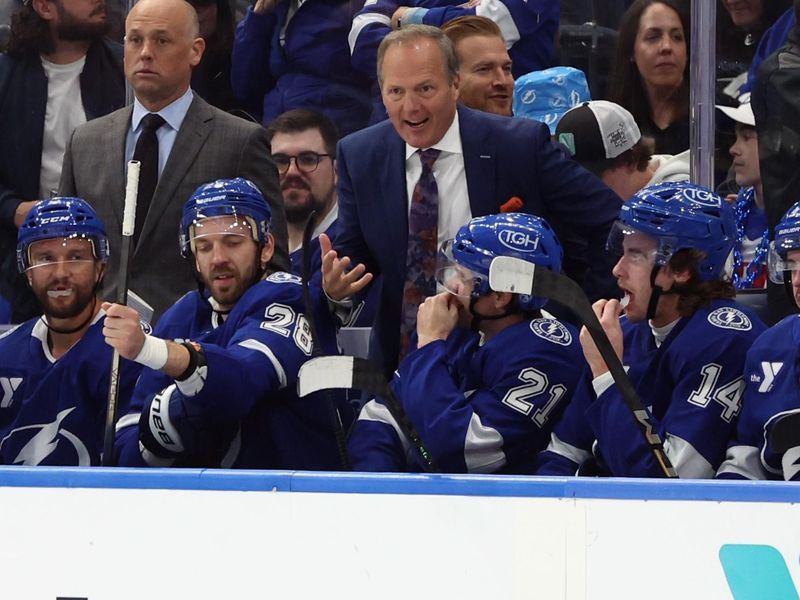 Nov 27, 2024; Tampa, Florida, USA; Tampa Bay Lightning head coach Jon Cooper looks on against the Washington Capitals during the first period at Amalie Arena. Mandatory Credit: Kim Klement Neitzel-Imagn Images