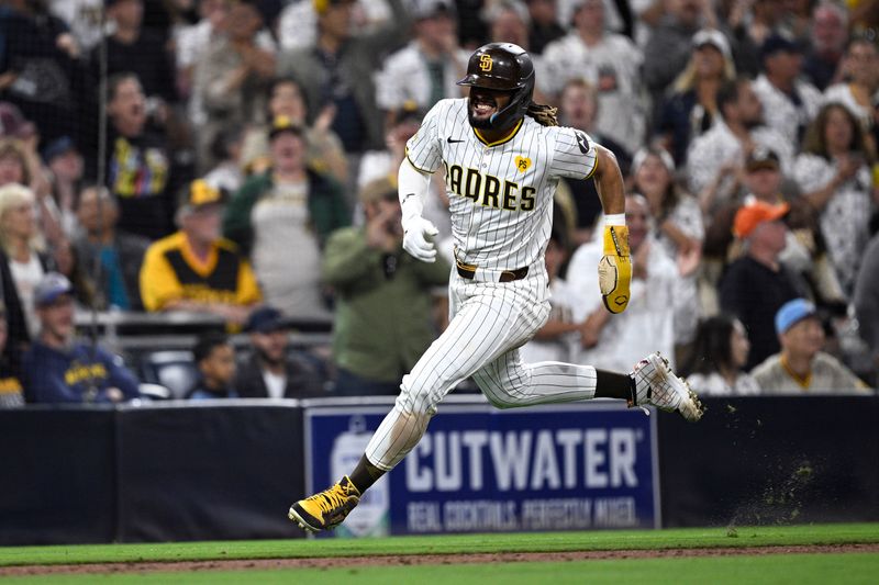 Jun 20, 2024; San Diego, California, USA; San Diego Padres right fielder Fernando Tatis Jr. (23) advances home to score a run against the Milwaukee Brewers during the seventh inning at Petco Park. Mandatory Credit: Orlando Ramirez-USA TODAY Sports