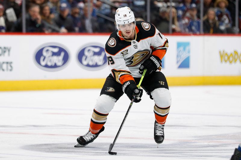 Dec 5, 2023; Denver, Colorado, USA; Anaheim Ducks right wing Troy Terry (19) controls the puck in the third period against the Colorado Avalanche at Ball Arena. Mandatory Credit: Isaiah J. Downing-USA TODAY Sports