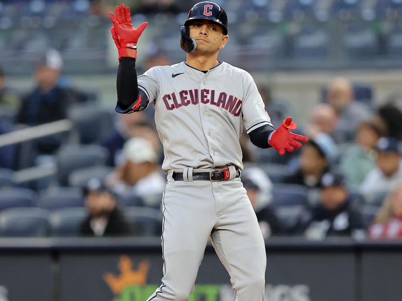 May 3, 2023; Bronx, New York, USA; Cleveland Guardians second baseman Andres Gimenez (0) reacts after hitting an RBI single against the New York Yankees during the first inning at Yankee Stadium. Mandatory Credit: Brad Penner-USA TODAY Sports