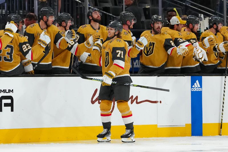 Apr 2, 2024; Las Vegas, Nevada, USA; Vegas Golden Knights center William Karlsson (71) celebrates with team mates after scoring a goal against the Vancouver Canucks during the second period at T-Mobile Arena. Mandatory Credit: Stephen R. Sylvanie-USA TODAY Sports