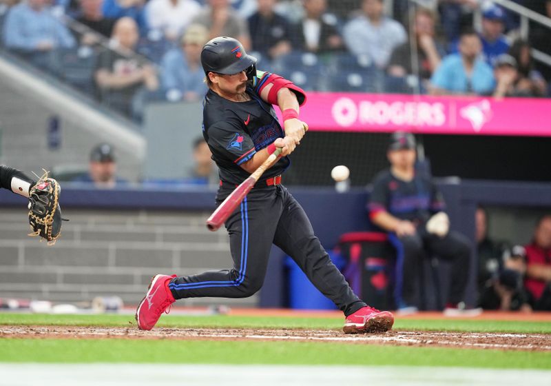 Jun 3, 2024; Toronto, Ontario, CAN; Toronto Blue Jays second baseman Davis Schneider (36) hits a single against the Baltimore Orioles during the fifth inning at Rogers Centre. Mandatory Credit: Nick Turchiaro-USA TODAY Sports