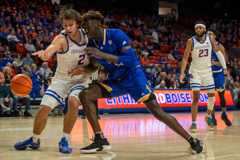 Jan 3, 2023; Boise, Idaho, USA; Boise State Broncos forward Tyson Degenhart (2) knocks the ball away from San Jose State Spartans center Ibrahima Diallo (5) during the first half at ExtraMile Arena. Mandatory Credit: Brian Losness-USA TODAY Sports

