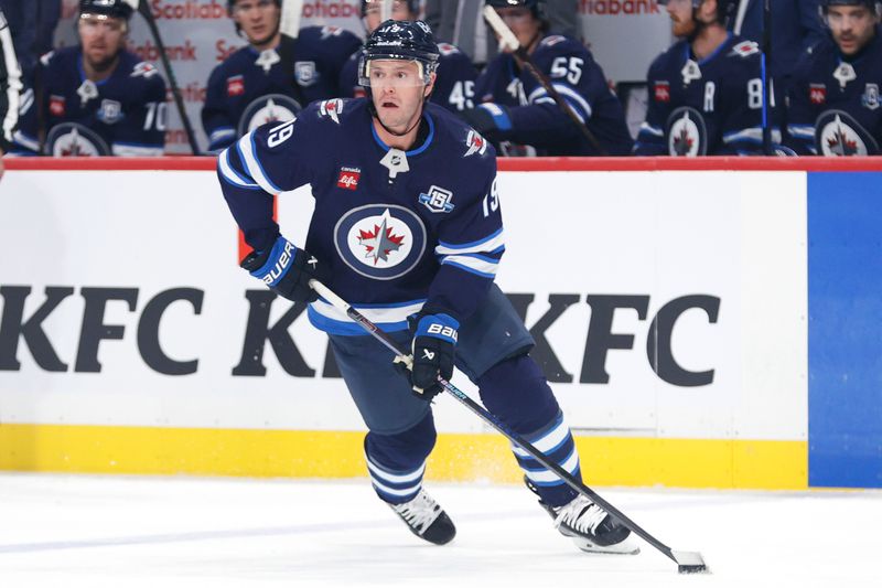 Oct 11, 2025; Winnipeg, Manitoba, CAN; Winnipeg Jets center Jonathan Toews looks up the ice during a game against the Los Angeles Kings in the first period at Canada Life Centre. Mandatory Credit: James Carey Lauder-Imagn Images